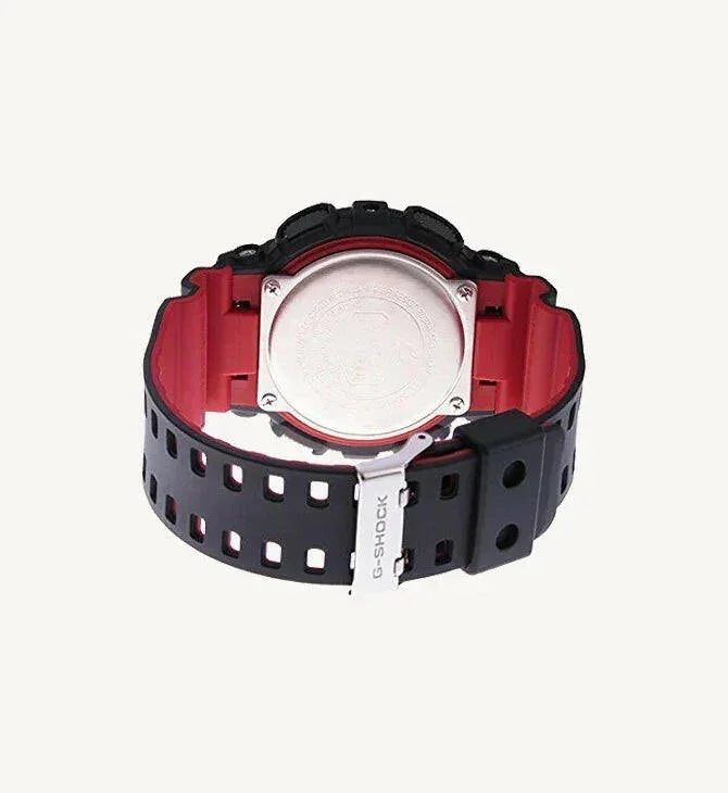 Back view of black and red G-Shock watch with metal case back and perforated strap