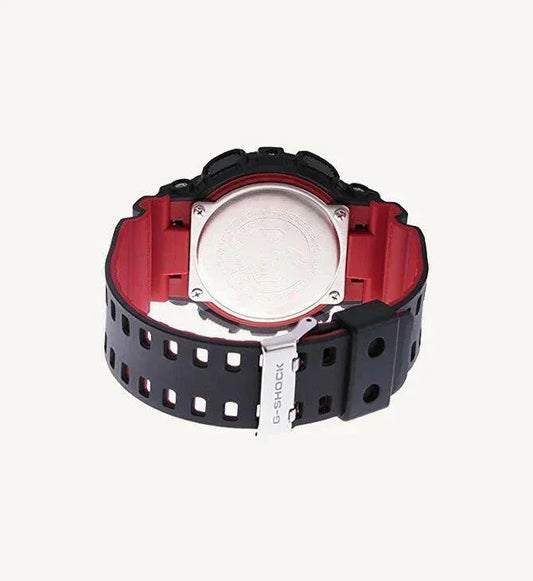 Back view of black and red G-Shock watch with metal case back and perforated strap